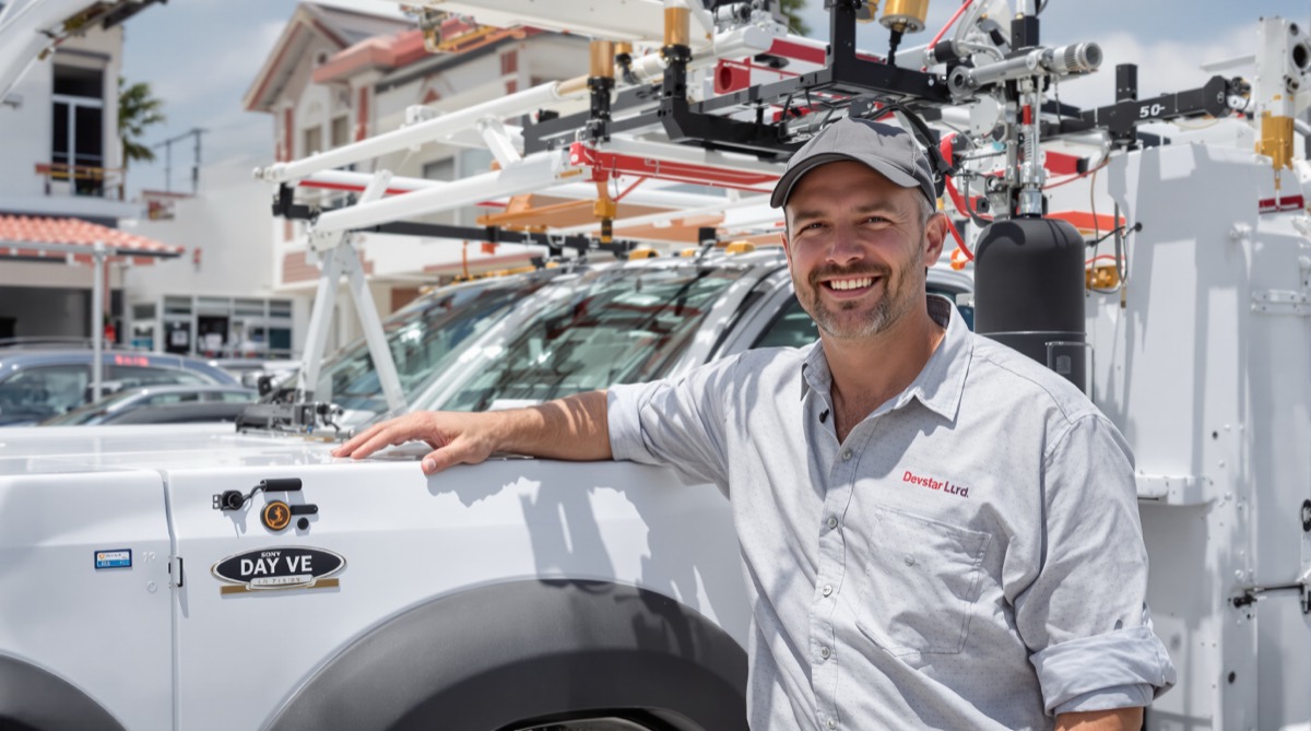 Contractor with his new work truck with a utility body